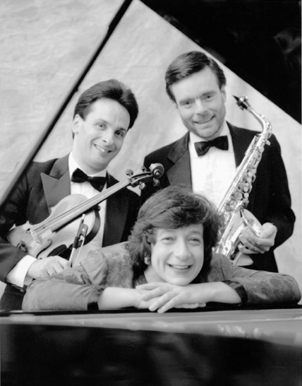 Cleveland Duo members, Stephen and Carolyn Warner are  pictured with saxophonist, James Umble.  They will perform a diverse program of musical compositions by Brahms, Bruch, Dykstra, Villa-Lobos, Telemann, Bartok and Piazolla in a concert on April 8, 2001.